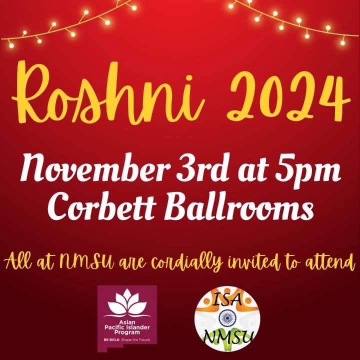 The image is a promotional graphic with a vibrant red background. At the top, there's a string of glowing lights stretching across diagonally, adding a festive touch. In bold, yellow script font, the words "Roshni 2024" are prominently displayed. Below, in white serif font, the event details "November 3rd at 5pm, Corbett Ballrooms" are provided. A smaller line of yellow script text reads, "All at NMSU are cordially invited to attend." Two logos are at the bottom: the left one features the text "Asian Pacific Islander Program" alongside a stylized leaf graphic, and the right logo displays "ISA NMSU" within a circle divided into three segments colored orange, white with a navy blue emblem, and green, resembling a flag.